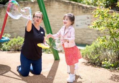 Isabella playing with bubbles