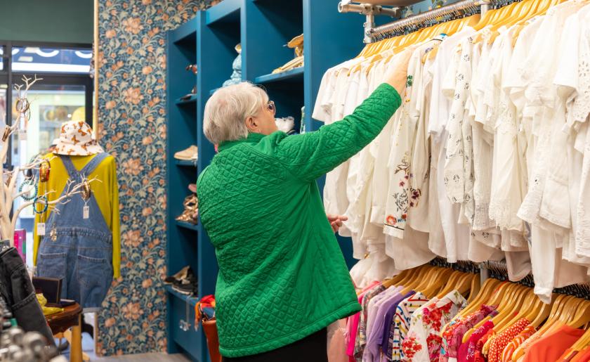 Customer browses clothes in Julia's House Swindon shop