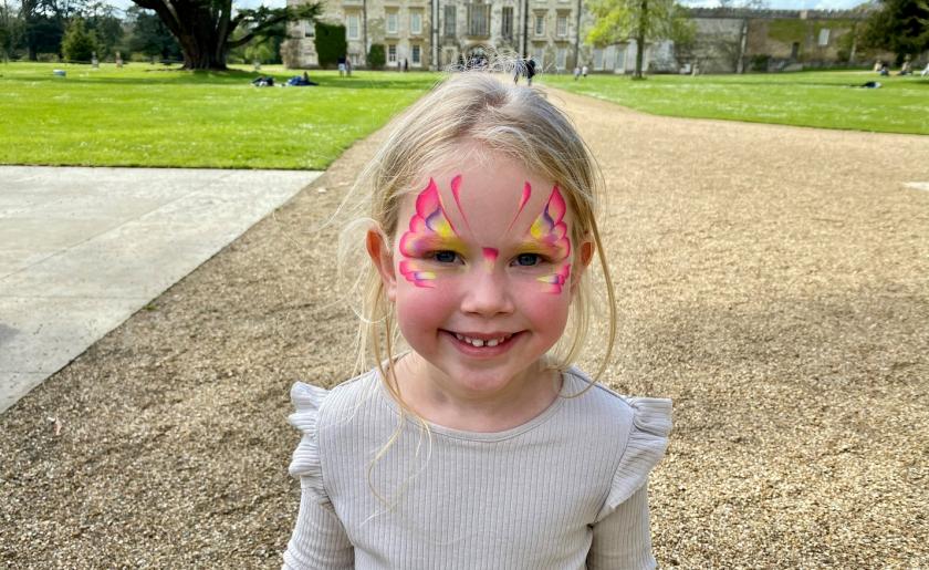 Scarlett has her face painted at Julia's House Easter trail