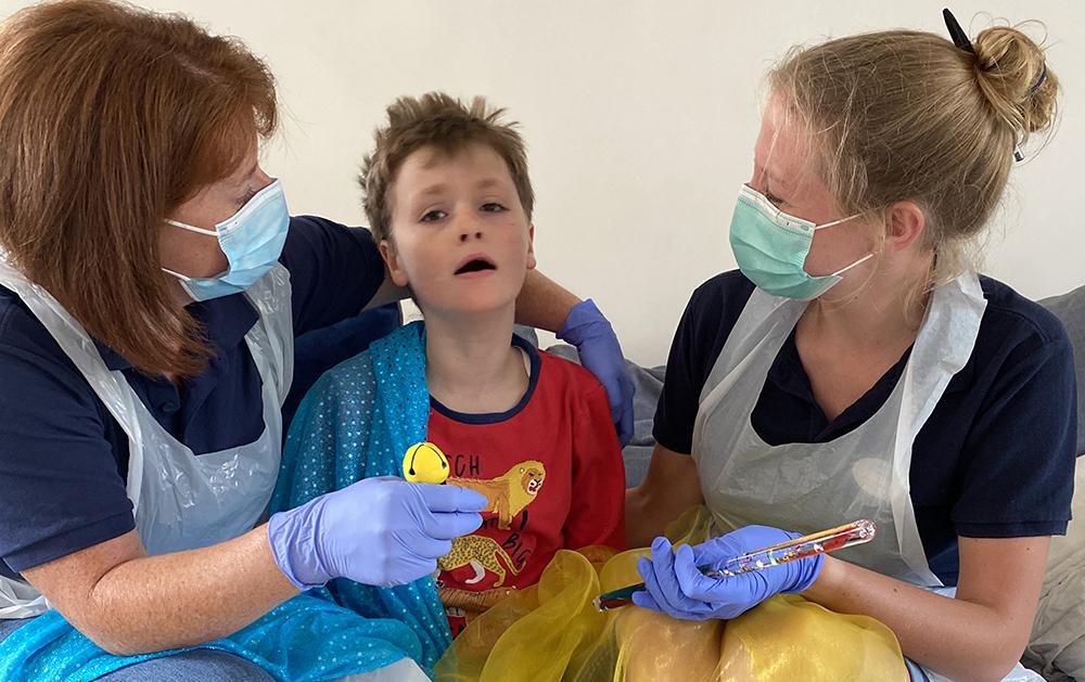 Noah with his Julia's House carers