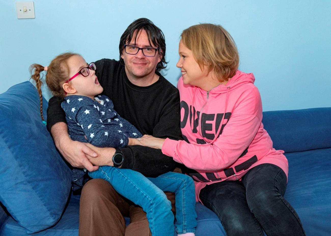 Elisa, seven with her dad Dan and mum Maiju