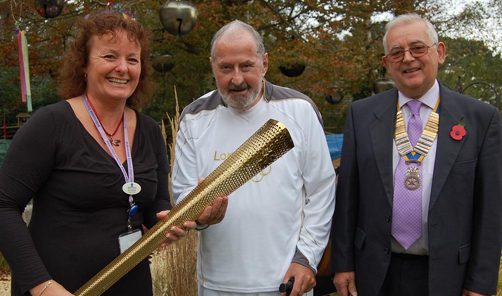Mike carrying the Olympic torch