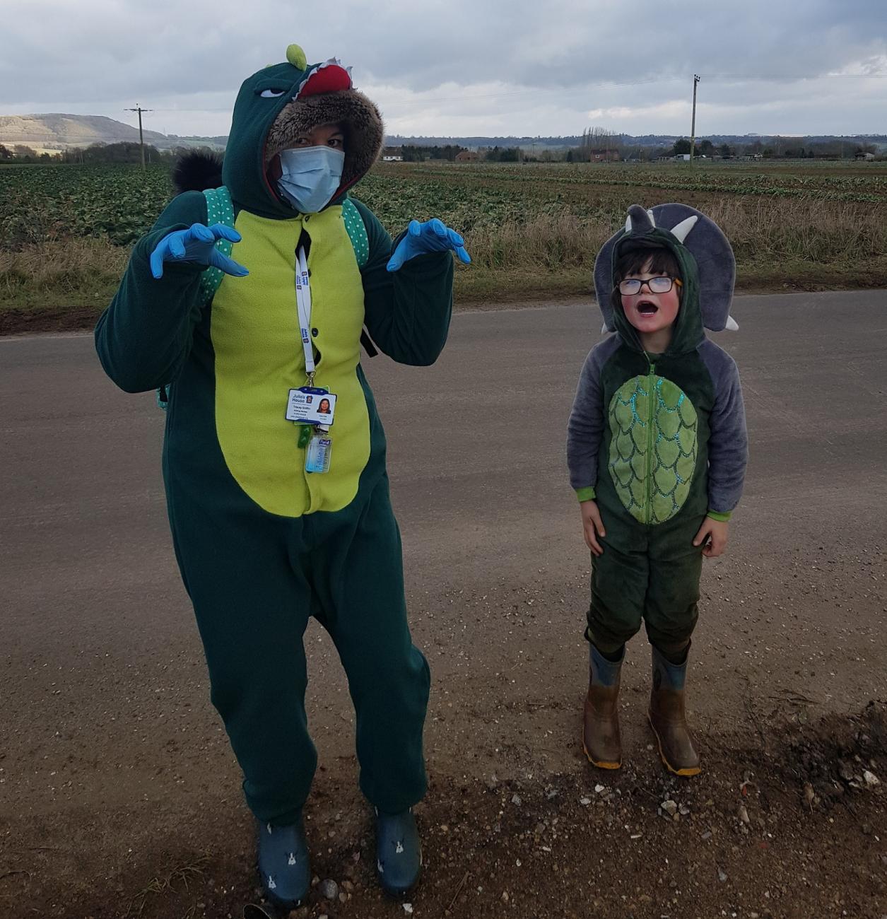 Tom and Tracey dress up as dinosaurs