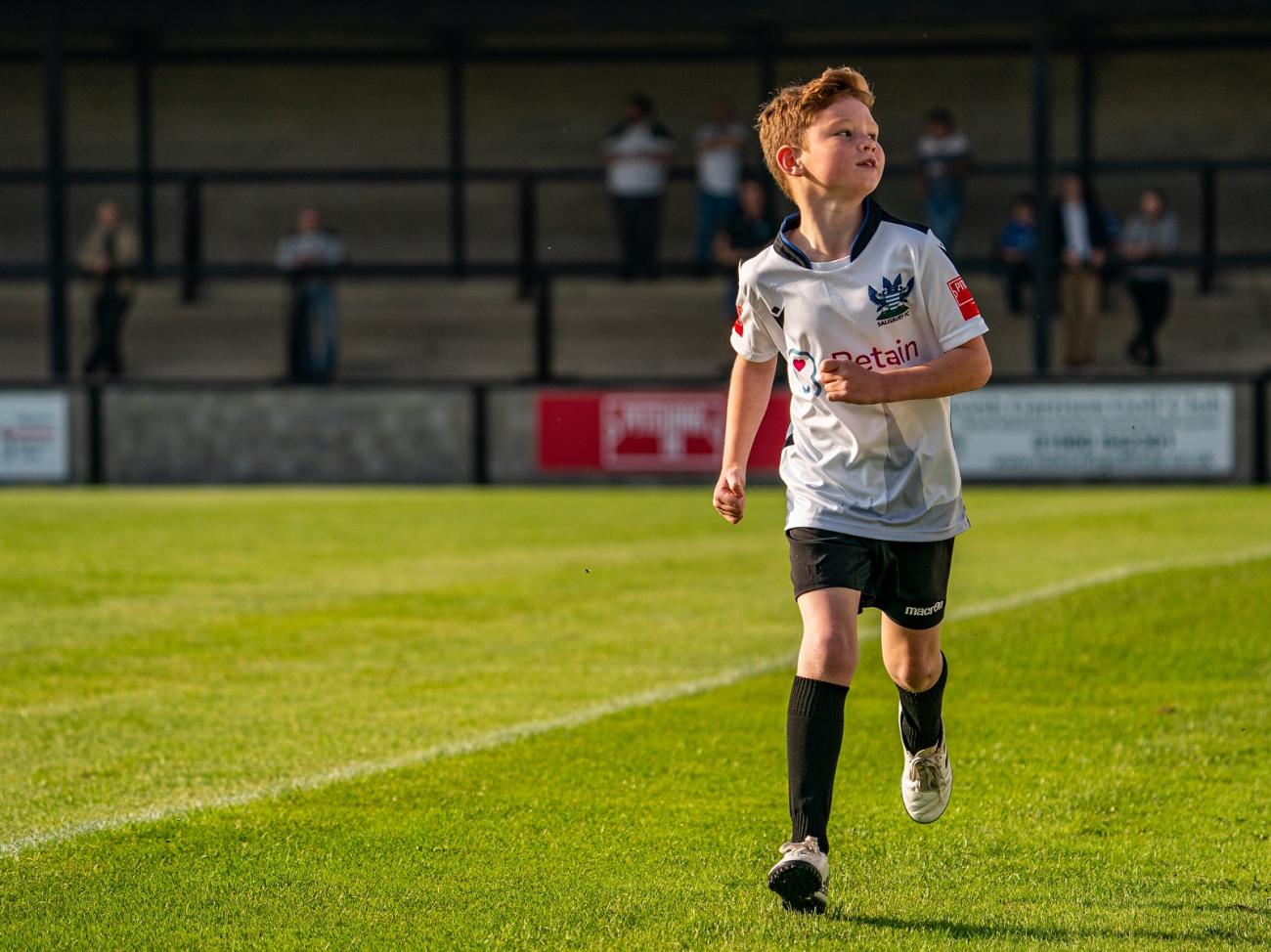 Harry runs around Salisbury pitch, photo by Michael Berkeley