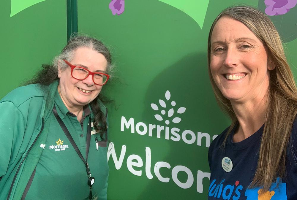 Julia's House corporate fundraiser Caroline with a member of staff from Morrisons store in Verwood