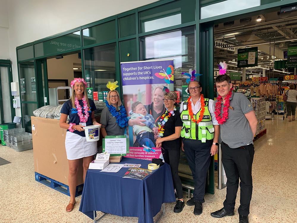 Caroline Attreed, Corporate Fundraiser for Julia's House with Julie Whelan, Charity Champion for Morrisons Verwood and colleagues during Carnival Week