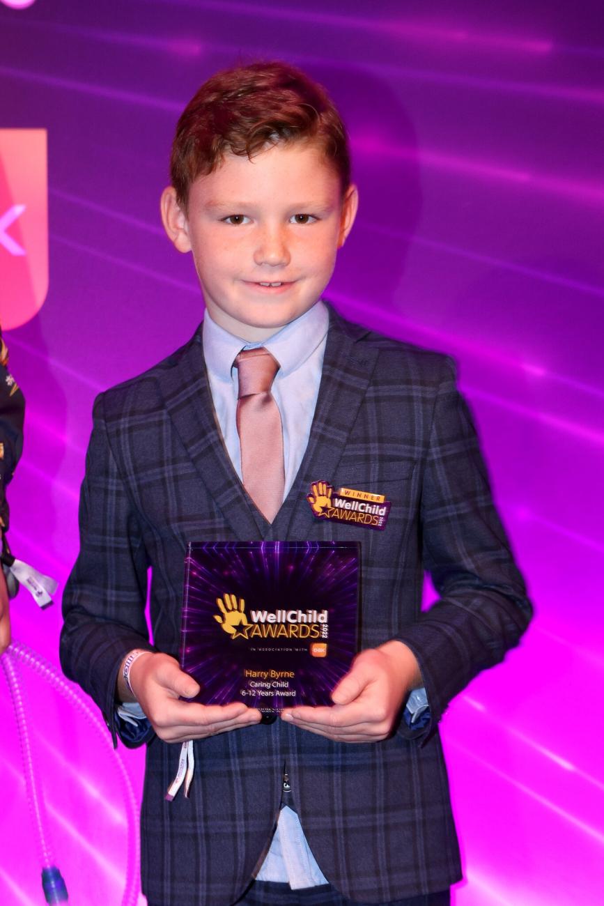 Harry holding his WellChild Award