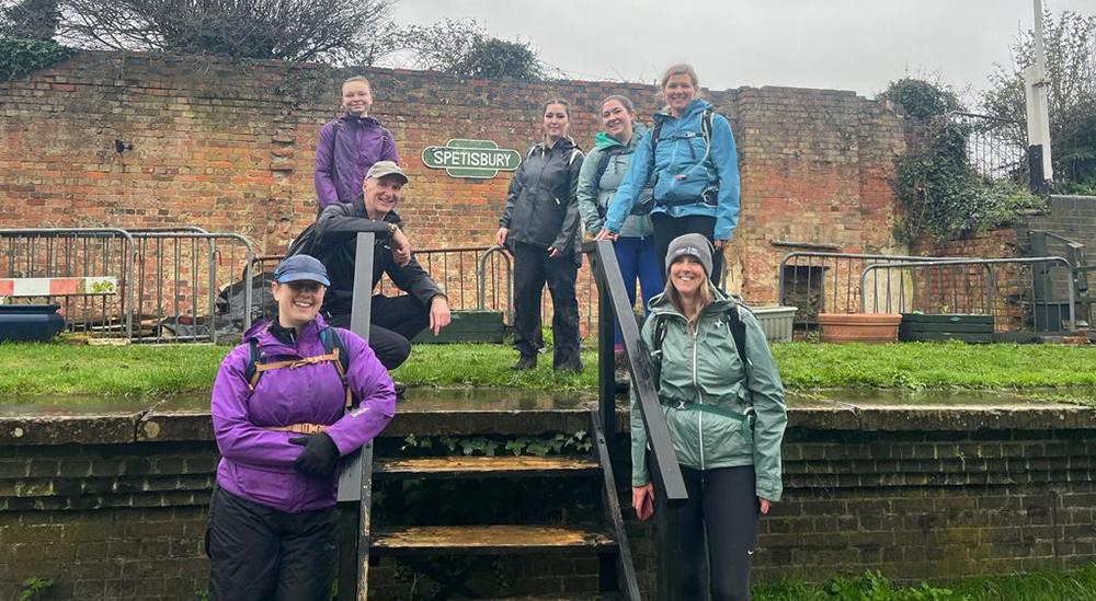 Team Gabby pose next to a sign saying 'Spetisbury'