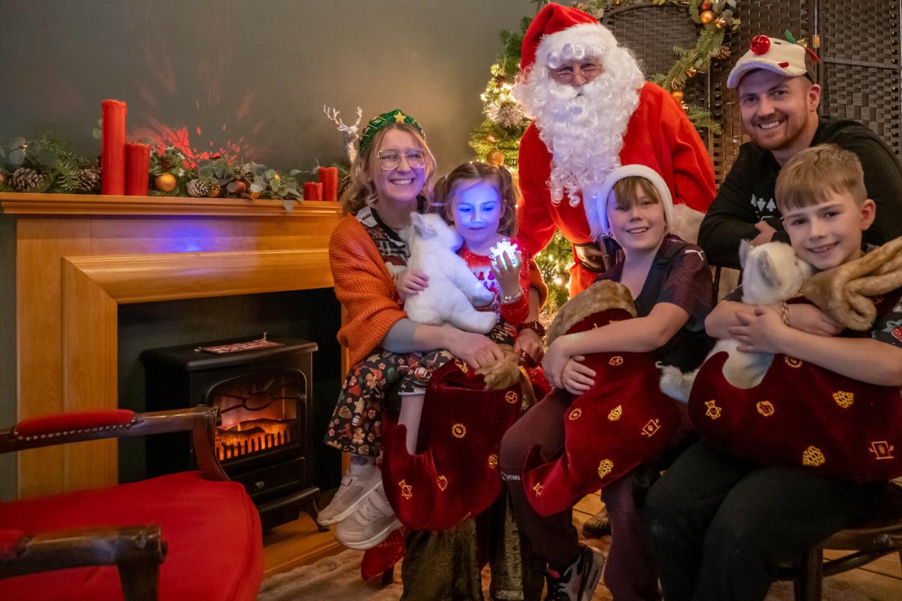 Skye with her family and Father Christmas at the Julia's House Santa's Grotto