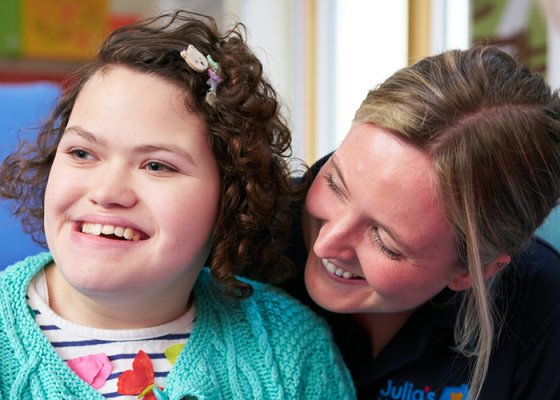 Hope, enjoying a session at Julia's House Children's Hospice with Nurse Molly and her Mum