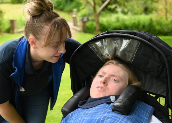 James, in the Julia's House Children's Hospice garden with one of his nurses.